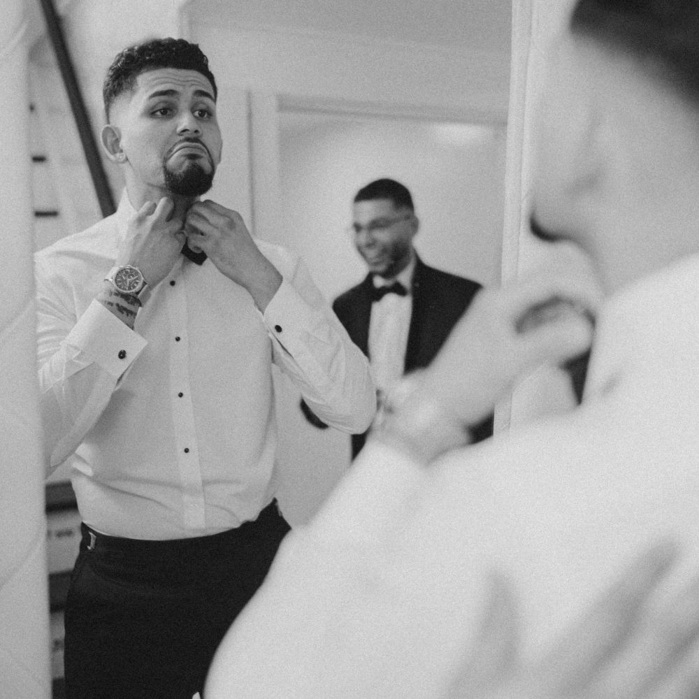 Groom preparing for wedding day in NJ, cinematic wedding film style